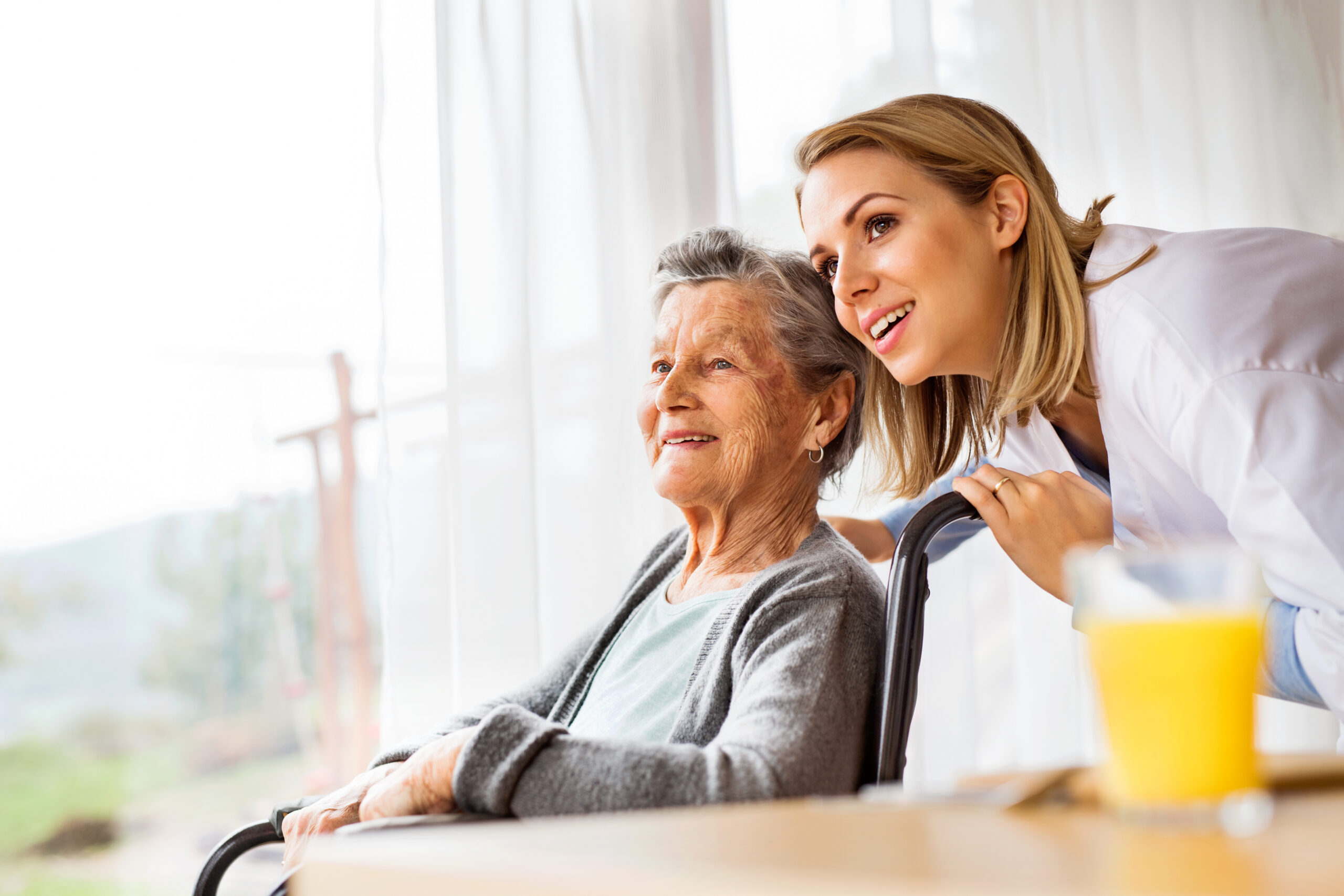 Older woman at home with her caregiver.